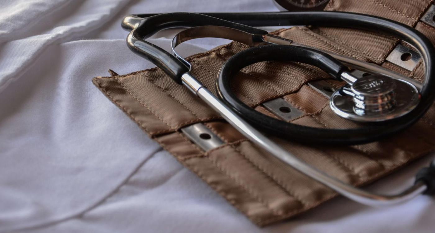 Stethoscope laying on hospital bed